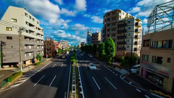 Um timelapse de rua de carro na avenida Kanpachi em Tóquio durante o dia tiro largo panning — Vídeo de Stock