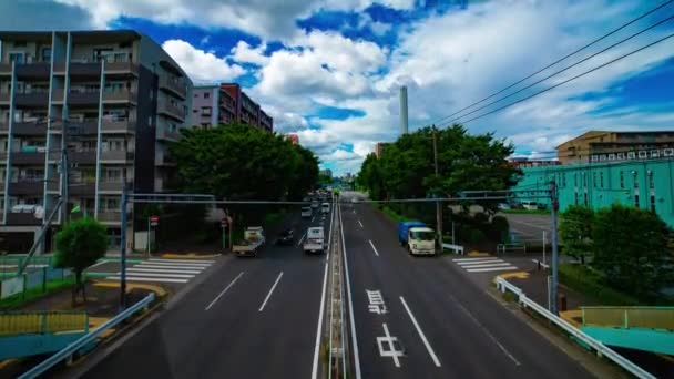 Une chronométrage de la rue de la voiture à Kanpachi avenue à Tokyo diurne grand angle inclinaison — Video