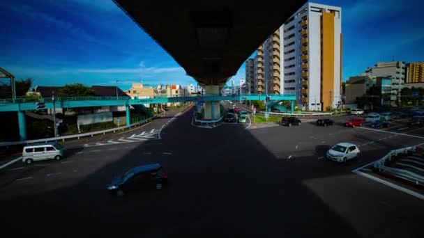A timelapse of downtown street at Kanpachi avenue in Tokyo daytime wide shot tilt — Stock Video