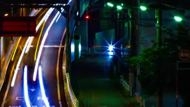 Sebuah malam tiLapse dari jalan kota di pusat kota di Setagaya Tokyo tembakan panjang panning — Stok Video