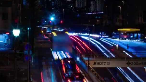 Een avond timeapse van de verkeersopstopping bij de stad straat in Tokio lange schot zoom — Stockvideo