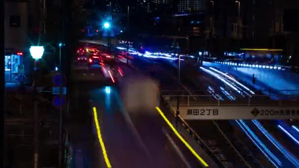 Sebuah malam tiLapse kemacetan lalu lintas di jalan kota di Tokyo tembakan panjang — Stok Video