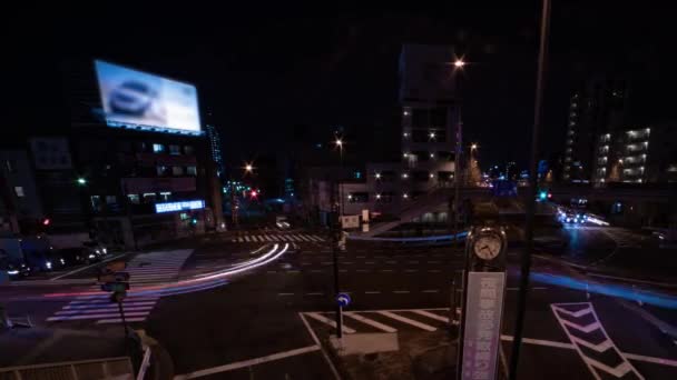 Een avond tijdsspanne van de file op de stad straat in Tokio brede schot panning — Stockvideo