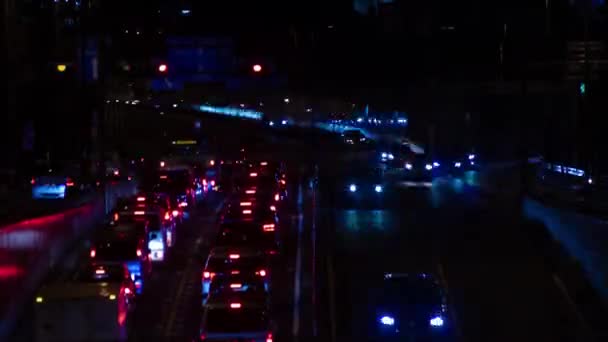 Un timelapse noche del atasco de tráfico en la calle de la ciudad en Tokio inclinación de largo plazo — Vídeos de Stock