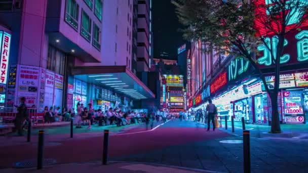 A night timelapse of the neon street at the downtown in Shinjuku Tokyo wide shot panning — Stock Video
