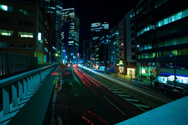 A night traffic jam at the urban street in Shibuya wide shot — Zdjęcie stockowe