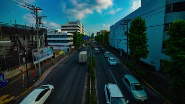 A timelapse of downtown street at Kanpachi avenue in Tokyo daytime wide shot tilt — Stock Video