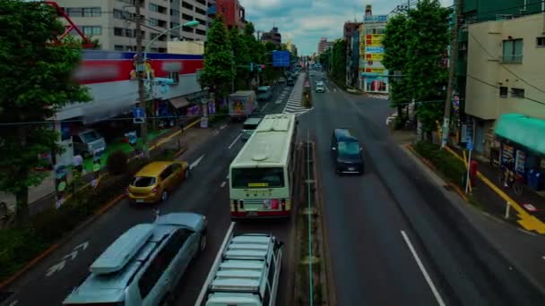 Sebuah timelapse dari jalanan pusat kota di jalan Kanpachi di Tokyo siang hari tembakan panning lebar — Stok Video