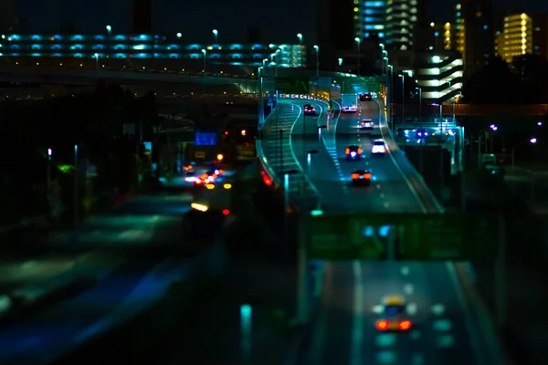 A night miniature traffic jam at the urban street in Tokyo — Stok fotoğraf