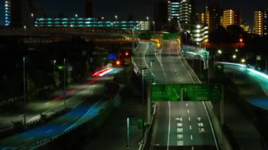 A night timelapse of the traffic jam at the urban street in Tokyo zoom