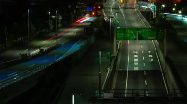 A night timelapse of the traffic jam at the urban street in Tokyo panning