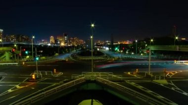 A night timelapse of the traffic jam at the urban street in Tokyo wide shot zoom