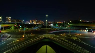 A night timelapse of the traffic jam at the urban street in Tokyo wide shot zoom