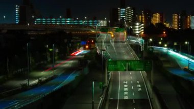 A night timelapse of the traffic jam at the urban street in Tokyo zoom