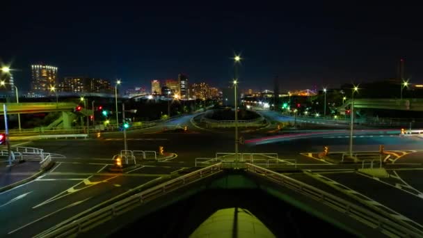 A night timelapse of the traffic jam at the urban street in Tokyo wide shot panning — Stock video