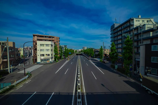 A downtown street at Kanpachi avenue in Tokyo wide shot — Zdjęcie stockowe