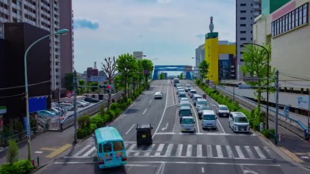 A timelapse of downtown street at Kanpachi avenue in Tokyo wide shot panning — Vídeo de stock