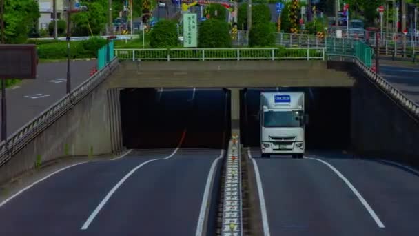 A timelapse of downtown street at Kanpachi avenue in Tokyo long shot panning — Wideo stockowe