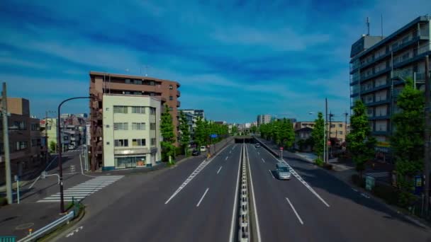 A timelapse of downtown street at Kanpachi avenue in Tokyo wide shot panning — Stockvideo