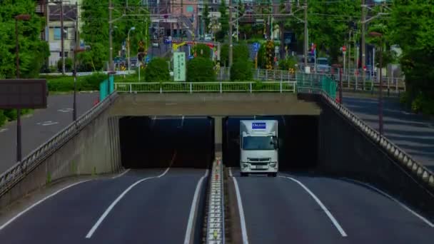 Un timelapse del centro della strada a Kanpachi avenue a Tokyo inclinazione colpo lungo — Video Stock