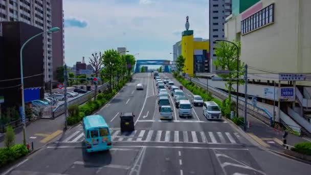 A timelapse of downtown street at Kanpachi avenue in Tokyo wide shot zoom — ストック動画