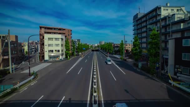 A timelapse of downtown street at Kanpachi avenue in Tokyo wide shot tilt — Stockvideo