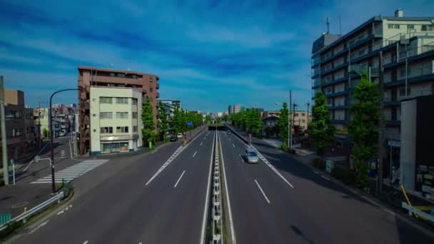 A timelapse of downtown street at Kanpachi avenue in Tokyo wide shot zoom — Stockvideo