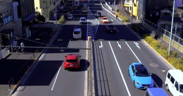 Samochody przyjść ang go na skrzyżowaniu Tomigaya w Tokio wysoki kąt — Wideo stockowe