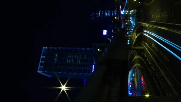 Night time lapse street at the business town in Akasaka Tokyo vertical — Stock fotografie