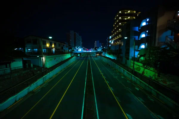 Een avond file in de benedenstad straat in Tokio wijd shot — Stockfoto
