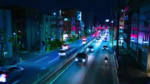 東京のダウンタウン通りでの渋滞の夜のタイムラプスワイドショットズーム — ストック動画