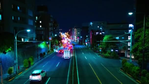 Un lapso de tiempo nocturno del atasco de tráfico en la calle del centro de Tokio inclinación de tiro ancho — Vídeos de Stock
