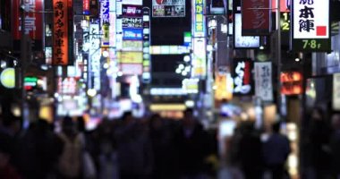 Walking people at the crossing rainy day at night. Shinjuku district Tokyo Japan - 01.09.2020 : It s legs of the people on the crossing.