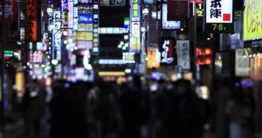 Walking people at the crossing rainy day at night. Shinjuku district Tokyo Japan - 01.09.2020 : It s legs of the people on the crossing.