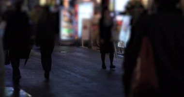 Walking people at the crossing rainy day at night. Shinjuku district Tokyo Japan - 01.09.2020 : It s legs of the people on the crossing.