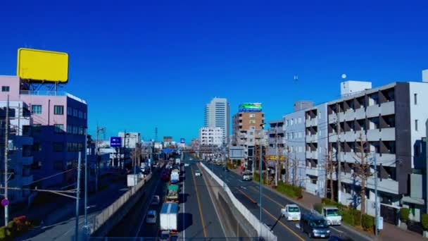 ダウンタウンの昼間のタイムラプスで路上で急いで車 練馬区東京 2019 交通渋滞です カメラ キヤノンEos 5Dマーク4 — ストック動画