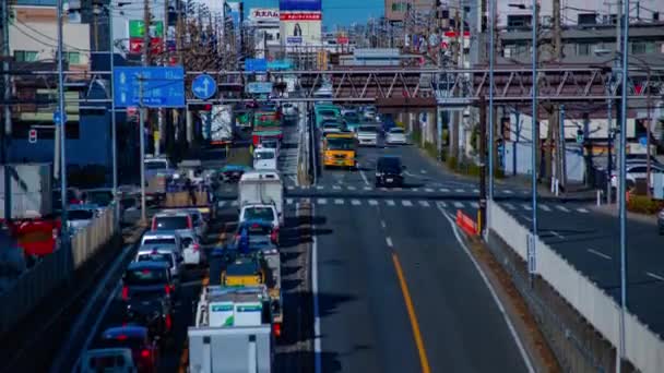 ダウンタウンの昼間のタイムラプスで路上で急いで車 練馬区東京 2019 交通渋滞です カメラ キヤノンEos 5Dマーク4 — ストック動画