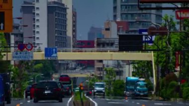 Tokyo 'daki şehir sokağındaki trafik sıkışıklığının zaman aşımı. Yüksek kalite 4K görüntü. Tokyo Japonya 05.18.2022 Tokyo 'da bir şehir caddesi.. 