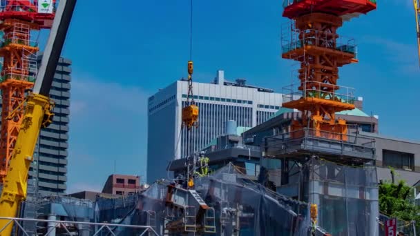 Временной Кран Стадии Строительства Токио Длинный Выстрел Панорамирование Высококачественные Кадры — стоковое видео