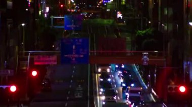 A night timelapse of the traffic jam at the urban street in Tokyo long shot. High quality 4k footage. Setagaya district Tokyo Japan 06.29.2022 Here is a downtown street in Tokyo