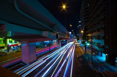 A night traffic jam under the highway in Tokyo wide shot. High quality photo. Setagaya district Tokyo Japan 07.11.2022 Here is a downtown street in Tokyo. 