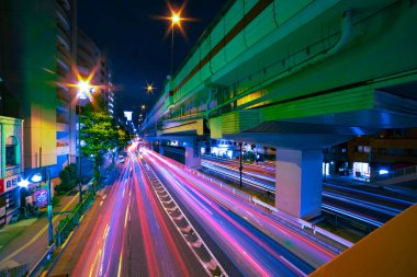 A night traffic jam under the highway in Tokyo wide shot. High quality photo. Setagaya district Tokyo Japan 07.11.2022 Here is a downtown street in Tokyo. 