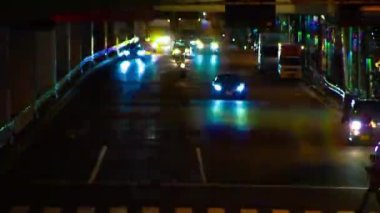 A night timelapse of the traffic jam under the highway in Tokyo long shot. Setagaya district Tokyo Japan 07.11.2022 Here is a downtown street in Tokyo. High quality 4k footage