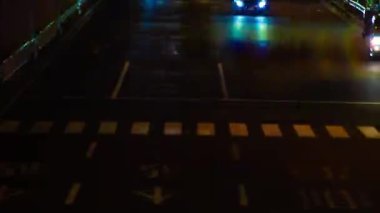 A night timelapse of the traffic jam under the highway in Tokyo long shot. Setagaya district Tokyo Japan 07.11.2022 Here is a downtown street in Tokyo. High quality 4k footage