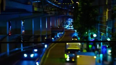 A night timelapse of the miniature traffic jam under the highway in Tokyo. Setagaya district Tokyo Japan 07.11.2022 Here is a downtown street in Tokyo. High quality 4k footage
