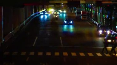 A night timelapse of the traffic jam under the highway in Tokyo long shot. Setagaya district Tokyo Japan 07.11.2022 Here is a downtown street in Tokyo. High quality 4k footage