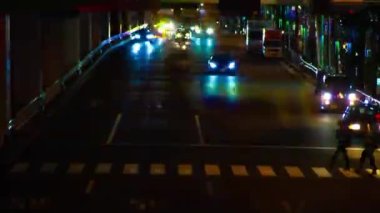 A night timelapse of the traffic jam under the highway in Tokyo long shot. Setagaya district Tokyo Japan 07.11.2022 Here is a downtown street in Tokyo. High quality 4k footage