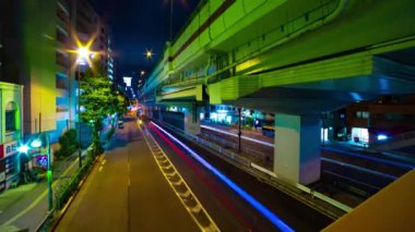 A night timelapse of the traffic jam at the urban street in Tokyo wide shot. Setagaya district Tokyo Japan 07.11.2022 Here is a downtown street in Tokyo. High quality 4k footage