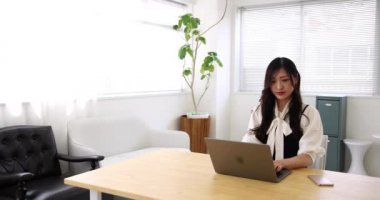 Tokyo Japan 06.19.2022. This working scene is acted by Japanese model in the office. High quality 4k footage