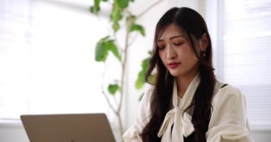 Tokyo Japan 06.19.2022. This working scene is acted by Japanese model in the office. High quality 4k footage